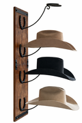 Handcrafted cowboy hat rack with three hats displayed
